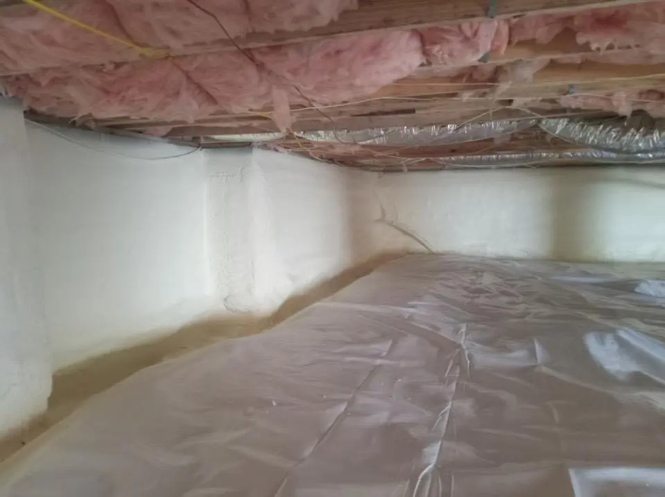Crawl space encapsulation with closed-cell spray foam for Commercial Roof Restoration in Northport